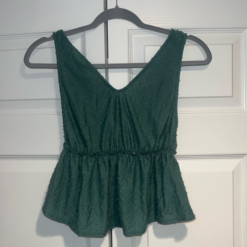 Teal peplum top, size medium. Worn once. Lower cut back.